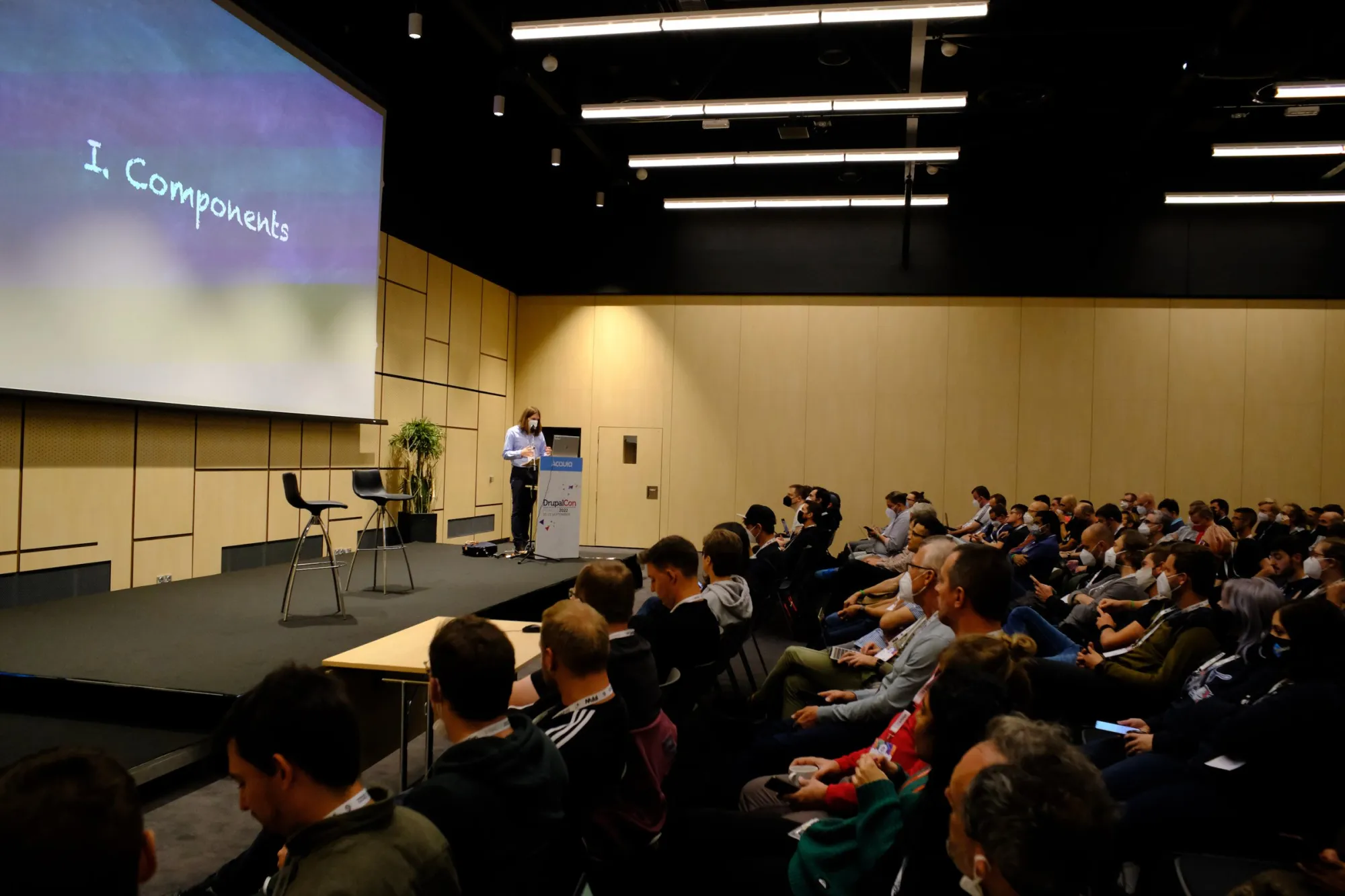 A packed audience watching a talk about components at DrupalCon Prague 2022